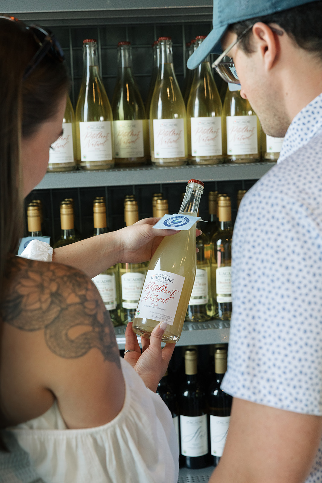 Transparency in wine. Organic and vegan wine certification logos on bottle in L'Acadie Vineyards wineshop in Gaspereau Nova Scotia